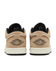 Heels of Jordan 1 Low SE Brown Elephant in brown and white.