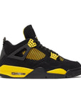 Side of Jordan 4 Retro Thunder (2023) in black and yellow
