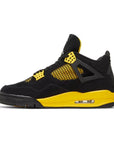Side of Jordan 4 Retro Thunder (2023) in black and yellow