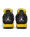 Heels of Jordan 4 Retro Thunder (2023) in black and yellow