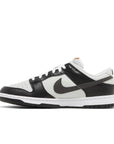 Side of Nike Dunk Low Black Total Orange Mini Swoosh in black, white and orange.
