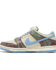 Side of Nike SB Dunk Low Crenshaw Skate Club in sail and blue.