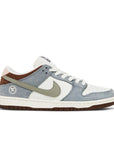Side of Nike SB Dunk Low Yuto Horigome in white and light grey