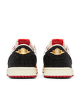 Heels of Jordan 1 Retro Low OG SP Trophy Room Away in red, black and white.