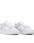 Pair of Nike Dunk Low photon dust in white and grey