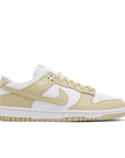 side of Nike Dunk Low team gold in white and gold