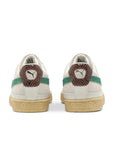 Heels of Puma Suede Rhuigi Villasenor in white, cream and green
