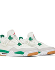Pair of Jordan 4 retro SB Pine Green in green and white