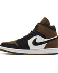 Side of the Air Jordan 1 Mid SE 'Olive Toe' is in a black and olive colourway
