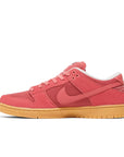 Side of Nike SB Dunk Adobe in pink and red