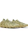 A pair of adidas Yeezy 450 Resin sneakers