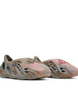 A pair of adidas Yeezy Foam Runner MX Sand Grey sneakers