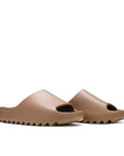 A pair of adidas Yeezy Slide Core sneakers