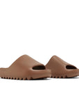 A pair of adidas Yeezy Slide Flax sneakers