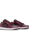 Pair of Jordan 1 low black dark beetroot in black, dark beetroot and white