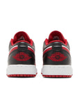 Heels of Jordan 1 Low Bulls Grade School (GS) in white black and red