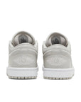 Heels of Jordan 1 Low SE Light Iron Ore (W) in Grey.