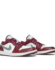 Pair of Jordan 1 Low White Bordeaux in white and Bordeaux.