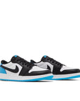 Pair of Jordan 1 Retro Low OG Black Dark Powder Blue (GS) in white, black and blue.