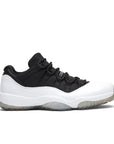 Side of Jordan 11 Retro Low Reverse Concord in Black and White