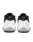 Heels of Jordan 11 Retro Low Reverse Concord in Black and White