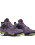 A pair of women's Nike Air Jordan 4 Retro Canyon Purple shoes in purple