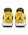 Heels of Jordan 4 Retro Lightning (2021) in Yellow and Dark Blue.