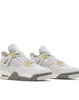 Pair of Jordan 4 Retro SE Craft Photon Dust in shades of grey.