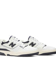 A pair of New Balance 550 Aime Leon Dore White Navy sneakers