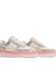 A pair of Nike Air Force 1 Low Our Force 1 Snakeskin womens sneakers