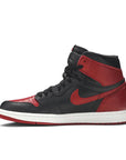 Side of Nike Air Jordan 1 basketball shoes in black and red Bred Banned colour
