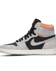 Side of Nike Air Jordan 1 basketball shoes in grey hyper crimson colour