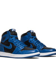A pair of Nike Air Jordan 1 Retro High OG Dark Marina Blue basketball shoes in black and dark blue