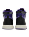 Heels of the women's Nike Air Jordan 1 High Zoom CMFT Purple Patent basketball shoes in purple and black