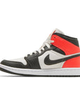 Side of the Jordan 1 Mid 'light Orewood Brown' is in a black and red colourway