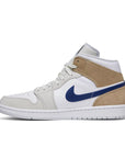 Side of the Jordan 1 Mid OG 'Tan suede' is in a white, light grey and shaggy beige colourway