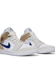 A pair of Nike Jordan Air 3 basketball shoes in a patchwork camo colour