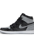 Side of Nike Air Jordan 1 basketball shoes in black grey and red rebellionaire colour