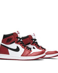 A pair of Nike Air Jordan 1 High Chicago 2015 basketball shoes in black, red and white