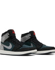 A pair of Nike Air Jordan 1 Retro High Element Gore-Tex Black Particle Grey basketball shoes in black, grey and dark green