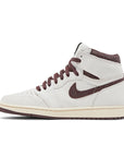 Side of the Air Jordan 1 A Ma Maniere is in a cream and maroon colourway