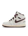 Side of the Air Jordan 1 A Ma Maniere is in a cream and maroon colourway