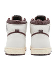 Heels of the Air Jordan 1 A Ma Maniere is in a cream and maroon colourway