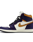 Side of the Nike Air Jordan 1 Retro High OG Defiant SB LA to Chicago basketball shoes in purple and gold