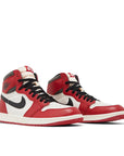 A pair of Air Jordan 1 Retro High OG 'Lost & Found' is in a black, red and white colourway