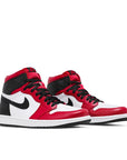 A pair of women's Nike Air Jordan 1 Retro High Satin Snake Chicago sneakers in black, red and white