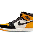 Side of Nike Air Jordan 1 Retro High Yellow Toe Taxi basketball shoes in yellow, white and black