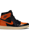 Side of Nike Air Jordan 1 basketball shoes in black and orange shattered backboard colour