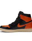Side of Nike Air Jordan 1 basketball shoes in black and orange shattered backboard colour