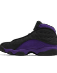 Side of Nike Jordan Air 13 basketball shoes in a black and purple colourway.